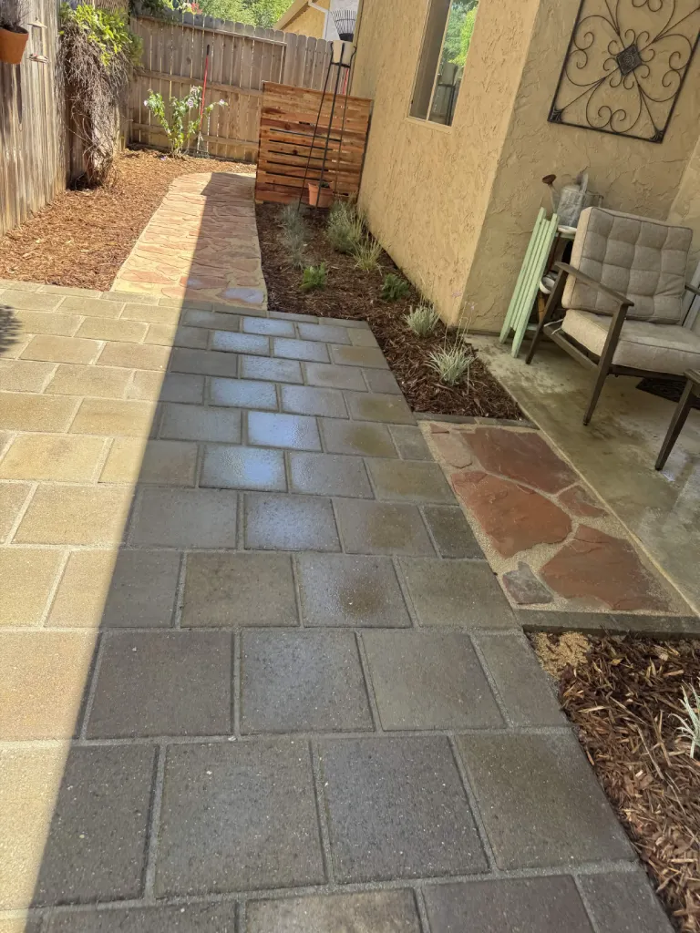 Paver and flagstone walkway installation along a home exterior